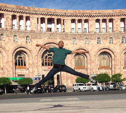 Danté Brown, a dancer for David Dorfman Dance, taken in the main square in Yerevan, Armenia during the David Dorfman Dance residency in May, 2014, for DanceMotion USA. Photo courtesy of David Dorfman Dance.