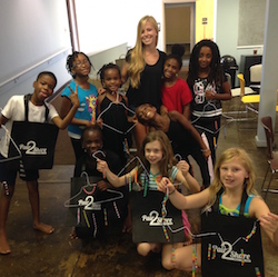 Juliana with Moving in the Spirit students and tap shoe wind chimes. Phtoo courtesy of Pair2Share.