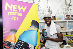 Chris Fonseca with the new Smirnoff ICE Electric drink. Photo by Craig Barritt/Getty Images for SMIRNOFF.