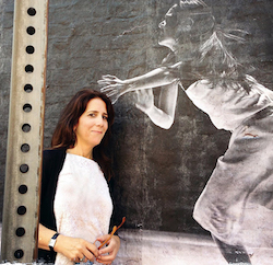 Stephanie Berger in front of her photo installation, Dancing in the Streets, at the LOOK3 Photo Festival, 2013. Photo courtesy of Berger.