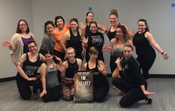 Sarah Bishop, bottom right, with students after teaching for Broadway Connection. Photo courtesy of Bishop.