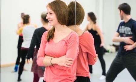 Emily Schoen watching rehearsal. Photo by Whitney Browne.