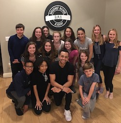 Noah Ricketts (kneeling center) teaching musical theatre to the students of Broadway Method Academy in Connecticut