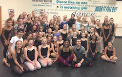 Michelle West, sitting front row center, with students after a Broadway Connection class. Photo courtesy of Broadway Connection.
