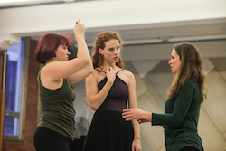 Heather Bryce (right) directing dancers. Photo by Art Heffron.