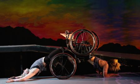 Kinetic Light dancers in a partnering backbend. Photo by Chris Cameron.