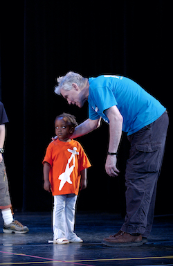 Jacques d’Amboise rehearses a young student before the 2004 Event of the Year, NDI’s annual performance starring the children. Photo courtesy of NDI.