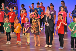 National Dance Institute Artistic Director Ellen Weinstein and Founder Jacques d’Amboise with the children of NDI taking bows after a performance at the NDI Center for Learning & the Arts. Photo courtesy of NDI.