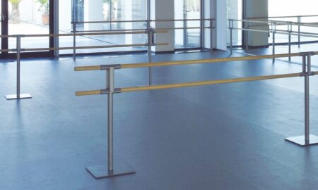 A dance studio with ballet barres.