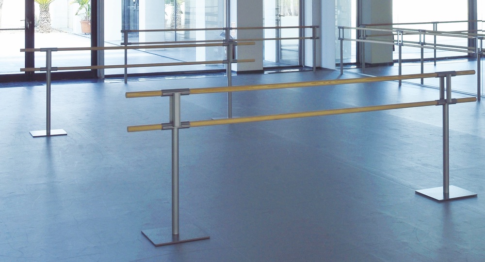 A dance studio with ballet barres.