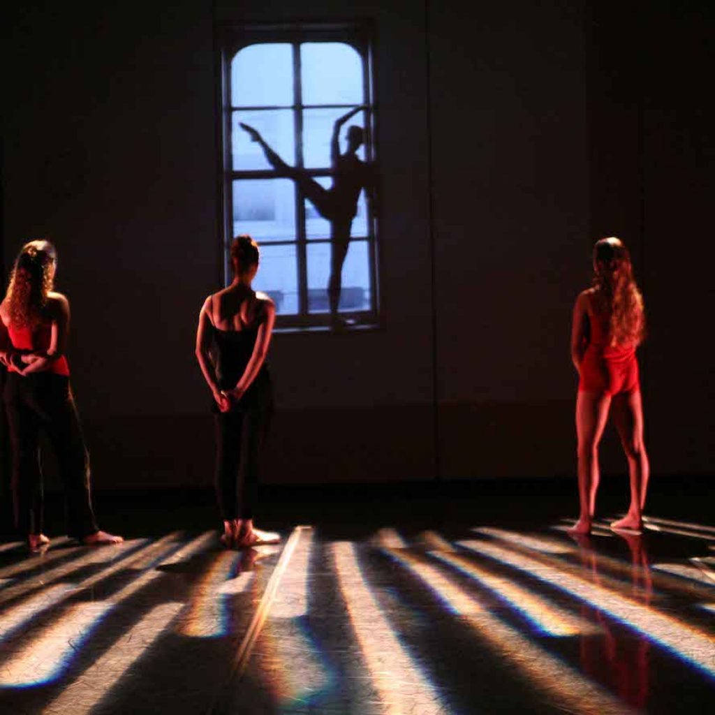 Felice Lesser Dance Theater in 'I Am a Dancer'. Photo by Gerry Goodstein, background video by Felice Lesser.