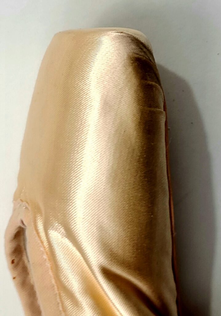 Tip of a pointe shoe.
