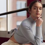 A ballerina posing by a window. Image by Freepik.