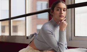 A ballerina posing by a window. Image by Freepik.