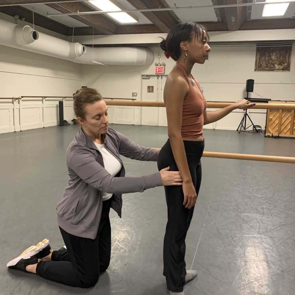 Andrea Zujko working with a dancer. Photo courtesy of Zujko.