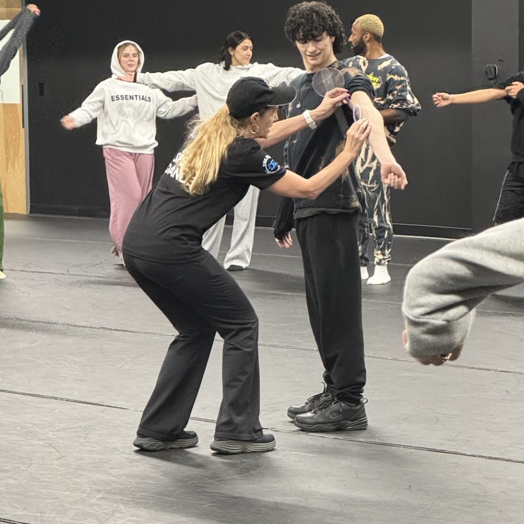 Hypermobility MD measuring elbow hyperextension at CLI. Photo courtesy of Linda Bluestein.