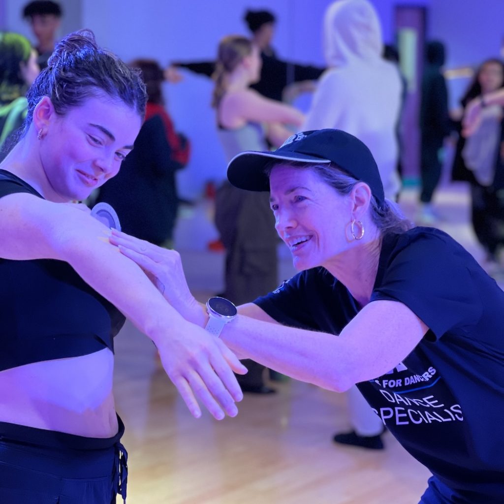 Hypermobility MD measuring elbow hyperextension at CLI. Photo courtesy of Linda Bluestein.